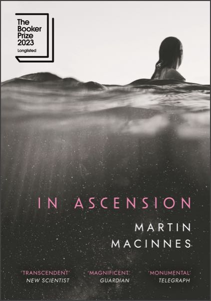 The cover of In Ascension by Martin Macinnes. A woman’s head breaches the ocean surface.